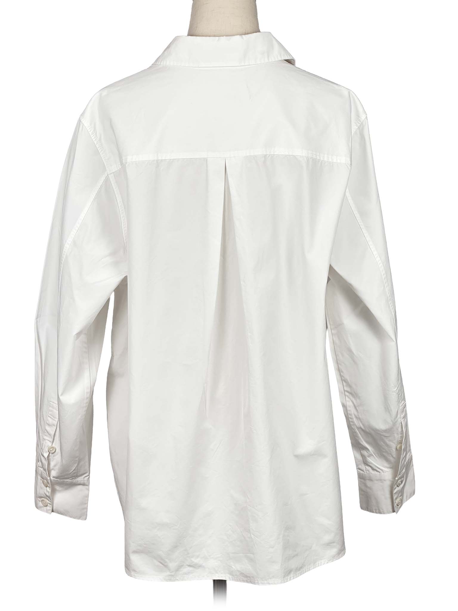 Shanghai Tang white shirt on a mannequin against a white background