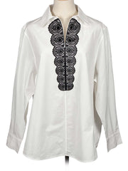 Shanghai Tang white shirt with black lace detailing on a mannequin against a white background
