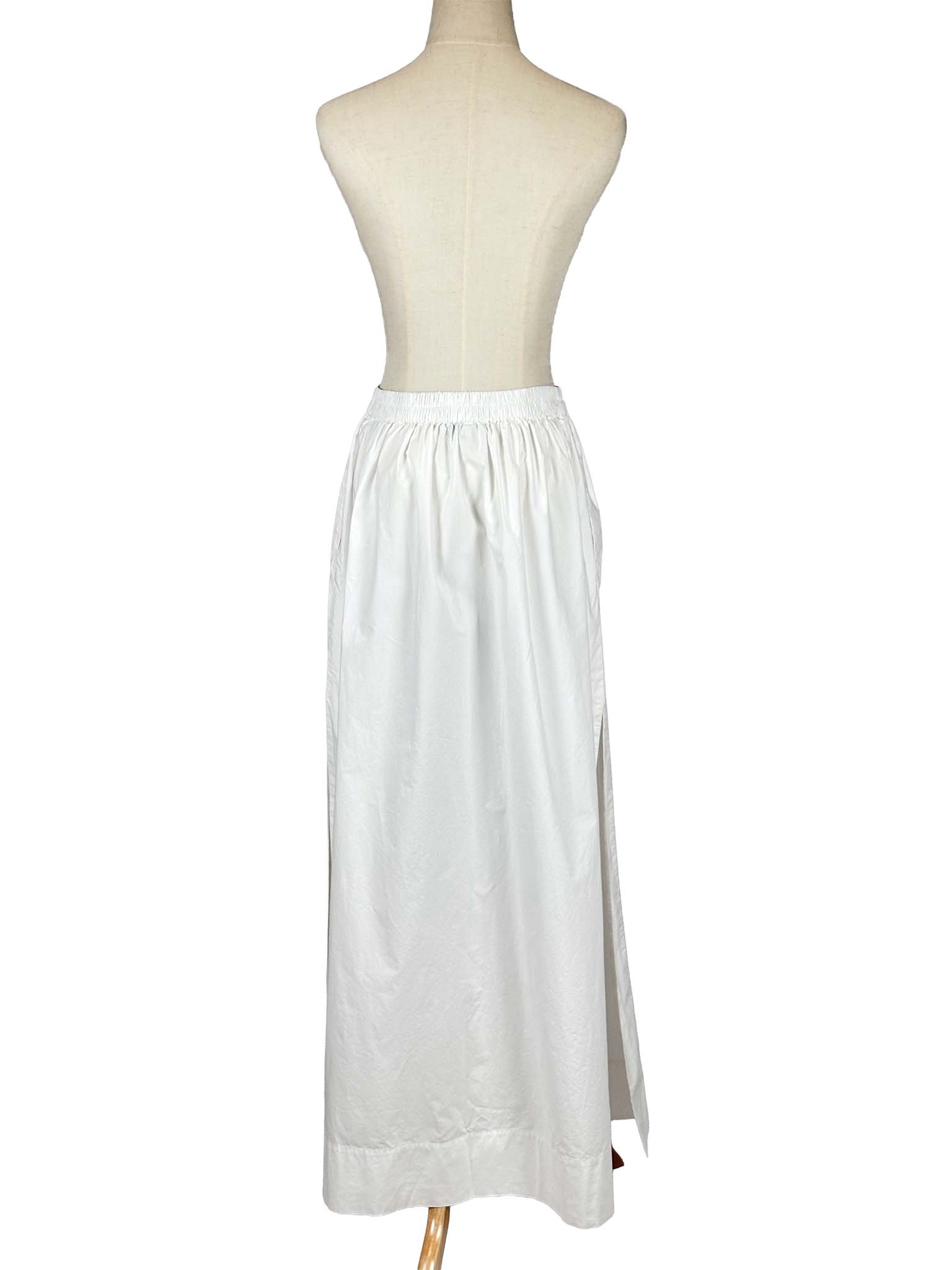 COS white skirt on a mannequin against a white background