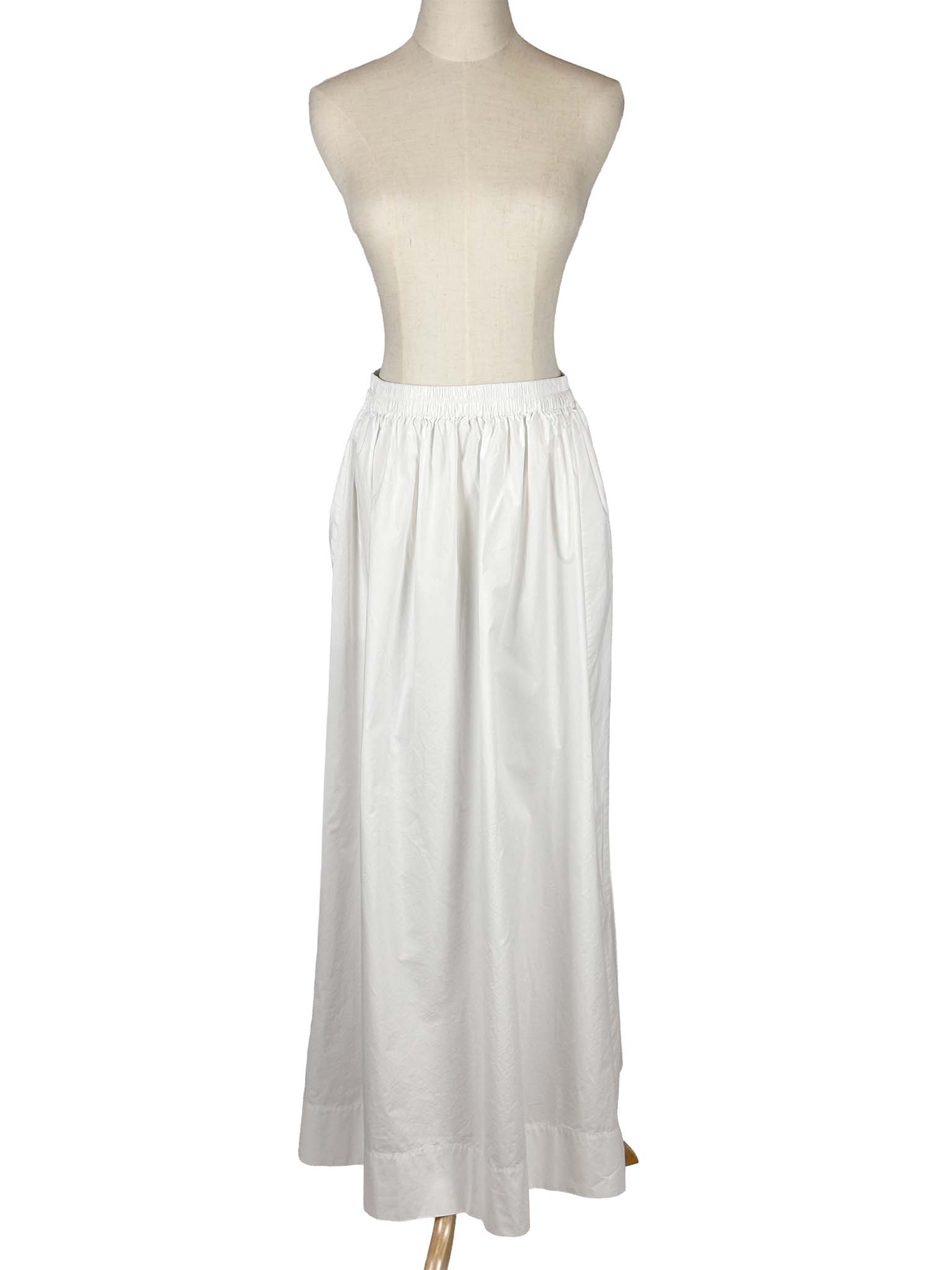 COS white skirt on a mannequin against a white background