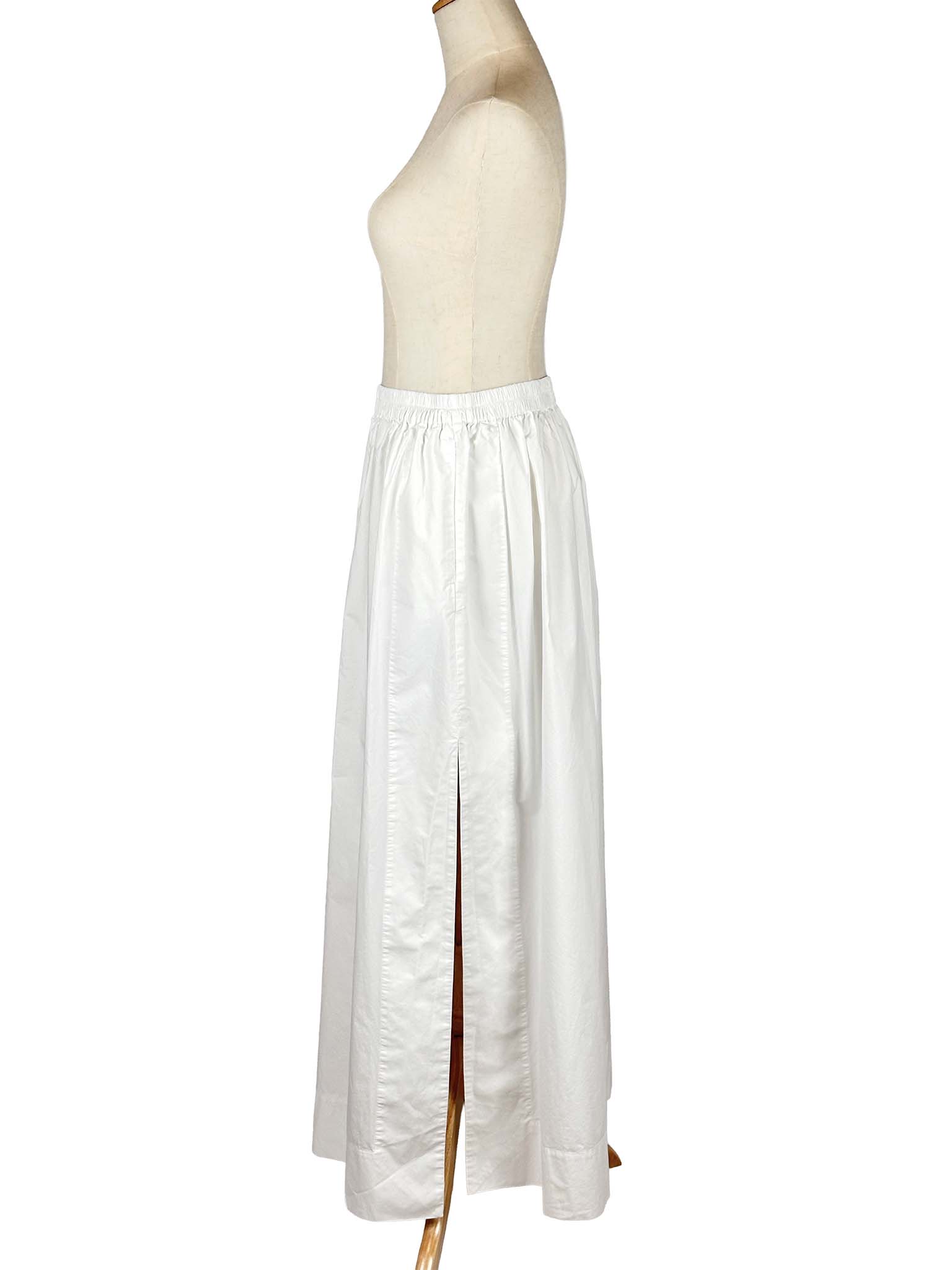 COS white skirt on a mannequin against a white background